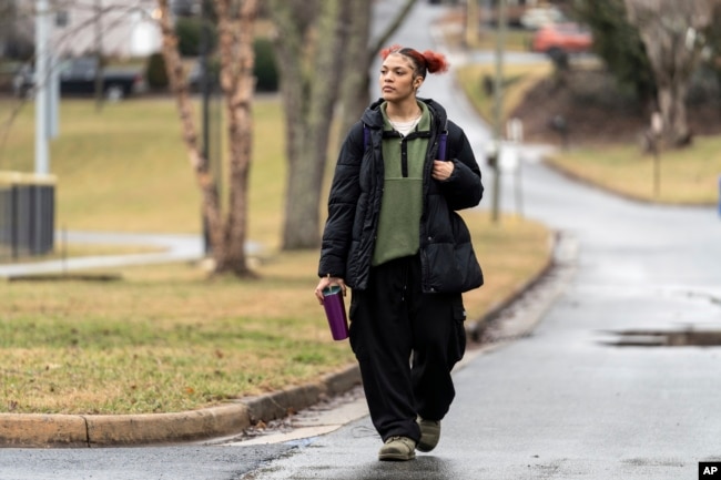 Kailani Taylor-Cribb walks through her neighborhood in Asheville, N.C., on Tuesday, Jan. 31, 2023. (AP Photo/Kathy Kmonicek)