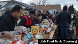 Volunteers at the Utah Food Bank in Salt Lake help distribute food to mobile pantry clients. According to the latest U.S. Census/AmeriCorps survey, Utah has the highest rate of volunteerism of any state in the United States.