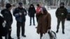 A woman receives food from local volunteers in Chasiv Yar, Feb. 14, 2023.