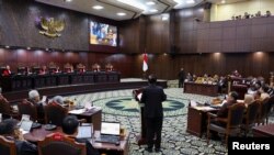 Vice presidential candidate, Mohammad Mahfud Mahmodin speaks at the hearing on the legal challenge against last month's election result, at Indonesia's constitutional court in Jakarta, Indonesia, March 27, 2024.
