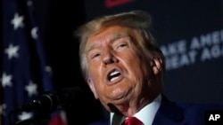 FILE - Former President Donald Trump speaks at a campaign rally, Aug. 8, 2023, at Windham High School in Windham, New Hampshire.