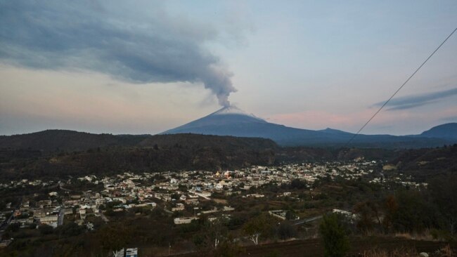 Ash and smoke billow from the Popocatepetl volcano as seen from the Santiago Xalitzintla community, state of Puebla, Mexico, on May 24, 2023.