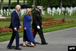 President Joe Biden and first lady Jill Biden participate in a wreath laying ceremony to pay their tribute to fallen US soldiers of the World War I, at the Aisne-Marne American Cemetery in Belleau, Northern France, June 9, 2024.