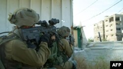 This handout picture released by the Israeli army on April 22, 2024, shows Israeli soldiers operating in the Gaza Strip.