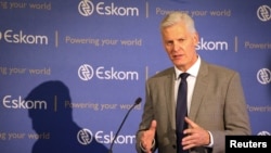 FILE - Then-CEO of state-owned power utility Eskom Andre de Ruyter speaks during a media briefing in Johannesburg, South Africa, Jan. 31, 2020.