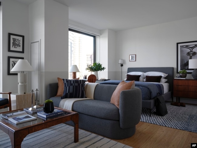 The colors in the this studio apartment in Brooklyn, New York, go well together and make the space feel calm. (BHDM/Dan Mazzarini via AP)