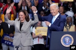 President Joe Biden and Vice President Kamala Harris finish speaking about their administration's efforts to lower prescription drug costs during an event at Prince George's Community College in Largo, Md., Aug. 15, 2024.