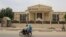 A motorcyclist drives past the Constitutional Council building in N'Djamena on March 14, 2024. Chad's Constitutional Council says it is examining the files of about 20 candidates in the race for the central African state's May 6 presidential polls. 