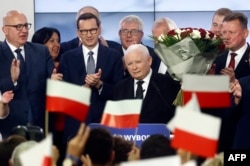 Deputy Prime Minister of Poland and Leader of the Law and Justice Party (PiS), Jaroslaw Kaczynski (center) and Polish Prime Minister Mateusz Morawiecki (number three from left) of the Law and Justice party at PiS headquarters in Warsaw, Poland October 15, 2023. (Wojtek Radwanski /AFP)