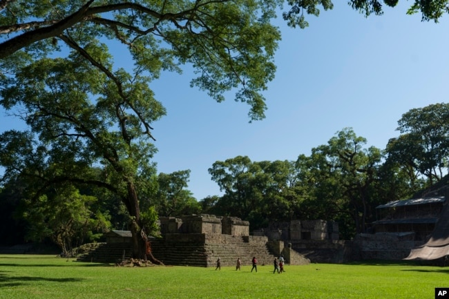 Tourists walk through the Acropolis of Copan, an ancient Maya site in western Honduras, Sunday, Sept. 24, 2023. (AP Photo/Moises Castillo)