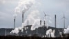 FILE - The industrial backdrop of a BP refinery and a Uniper coal-fired power plant is seen in Gelsenkirchen, Germany, March 6, 2023. 