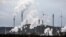 FILE - The industrial backdrop of a BP refinery and a Uniper coal-fired power plant is seen in Gelsenkirchen, Germany, March 6, 2023. 