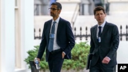 Alphabet CEO Sundar Pichai, left, and OpenAI CEO Sam Altman arrive at the White House for a meeting with Vice President Kamala Harris on artificial intelligence in Washington, May 4, 2023.