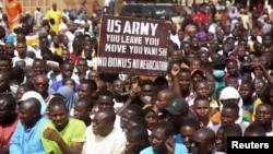 FILE — Nigeriens gather in a street to protest against the U.S. military presence, in Niamey, Niger April 13, 2024.