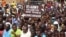 FILE — Nigeriens gather in a street to protest against the U.S. military presence, in Niamey, Niger April 13, 2024.
