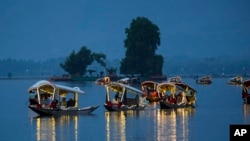 Delegates from the Group of 20 nations attending a tourism meeting enjoy boat ride at the Dal Lake in Srinagar, Indian-administered Kashmir, May 22, 2023.