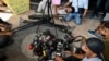 Journalists lay down their equipment as they protest the latest draft revision of the broadcasting law, which they consider a threat to press freedom, in Banda Aceh, Indonesia, on May 27, 2024. 
