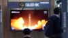 A TV screen shows a report of North Korea's rocket launch with a file image during a news program at the Seoul Railway Station in Seoul, South Korea, Aug. 24, 2023.