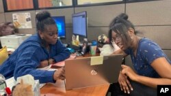 Success Coach Latasha Wiley, left, helps first-year student Amare Porter, right, with her class schedule at Chattahoochee Valley Community College's advising center on Feb. 23, 2023, in Phenix City, Alabama.