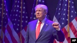 FILE - Mantan Presiden Donald Trump berbicara pada acara kampanye 13 Maret 2023, di Davenport, Iowa.
