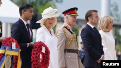 British Prime Minister Rishi Sunak, left, attends the UK national commemorative event for the 80th anniversary of D-Day, held at the British Normandy Memorial in Ver-sur-Mer, Normandy, France, June 6, 2024.
