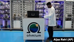 An engineer works at the Ohmium manufacturing facility in Chikkaballapur, India, Tuesday, April 25, 2023. The company announced April 26, 2023 it has raised $250 million to expand production of machines that can make clean hydrogen and displace fossil fuels. (AP Photo/Aijaz Rahi)