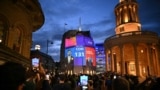 An exit poll predicting that the Conservative Party led by Britain's Prime Minister Rishi Sunak will only win 131 seats in Britain's general election is projected onto BBC Broadcasting House in London on July 4, 2024. 