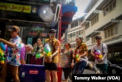 On April 13, 2024, foreign tourists celebrated the Songkran Festival by participating in a public water fight in Asoke, Bangkok, Thailand.