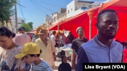 FILE - A popular market frequented by African migrants outside Tunis, Tunisia.