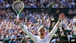 Barbora Krejcikova of the Czech Republic celebrates after defeating Jasmine Paolini of Italy in the women's singles final at the Wimbledon tennis championships in London, July 13, 2024. 