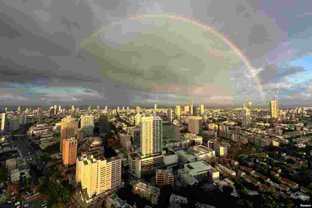 A rainbow appears in the sky on a rainy day in Tel Aviv, Israel.