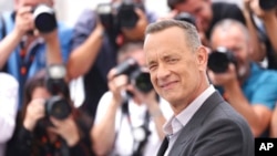 FILE - Tom Hanks poses for photographers at the photo call for the film 'Elvis' at the 75th international film festival, Cannes, southern France, May 26, 2022. 