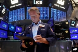 Trader Robert Charmak works on the floor of the New York Stock Exchange, Aug. 5, 2024. Not long ago, stocks suffered a major rout, only to soar back to near-record highs.