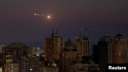 An explosion of a drone is seen in the sky over the city during a Russian drone strike, amid Russia's attack on Ukraine, in Kyiv, Ukraine, July 25, 2024.