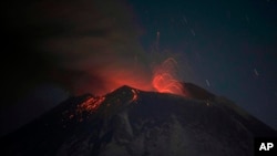 The Popocatepetl volcano erupts lava, ash and steam, seen from from Santiago Xalitzintla, Mexico, May 25, 2023.