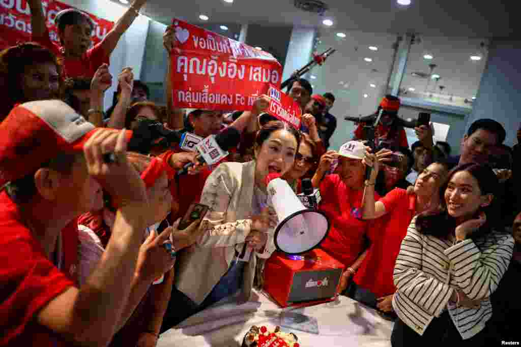 Pheu Thai&#39;s prime ministerial candidate, Paetongtarn Shinawatra, attends a birthday celebration held by red shirt supporters, a day ahead of her father, former Prime Minister Thaksin Shinawatra, coming home from self-exile, at the party headquarters in Bangkok, Thailand.