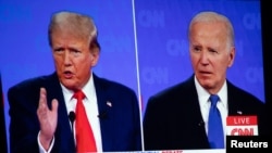 Detalj iz prenosa predsedničke debate na televiziji CNN (Foto: REUTERS/Emily Elconin)