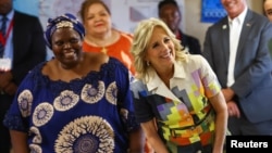 U.S. first lady Jill Biden, right, stands with Patricia Sola, founder of Hope Initiative Southern Africa in Windhoek, Namibia, Feb. 23, 2023.