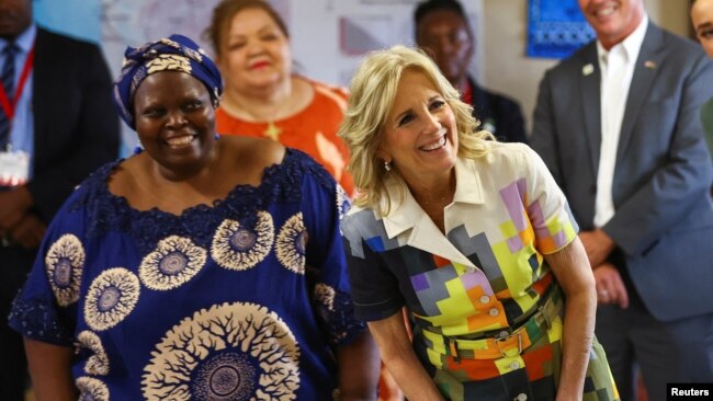 U.S. first lady Jill Biden, right, stands with Patricia Sola, founder of Hope Initiative Southern Africa in Windhoek, Namibia, Feb. 23, 2023.