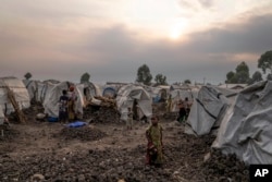 People displaced by fighting gather at a refugee camp on the outskirts of Goma, Democratic Republic of the Congo, July 11, 2024.