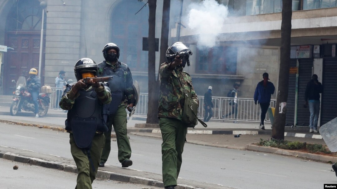 Police officers fire tear gas to disperse protesters during a demonstration over police killings of people protesting against Kenya's proposed finance bill 2024/2025, in Nairobi, June 27, 2024.