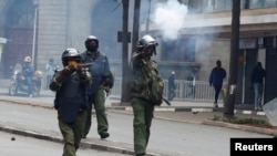 Police officers fire tear gas to disperse protesters during a demonstration over police killings of people protesting against Kenya's proposed finance bill 2024/2025, in Nairobi, June 27, 2024.