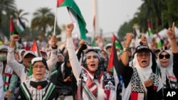 Aksi solidaritas dan doa untuk mendukung rakyat Palestina di Gaza, di Jakarta, Minggu, 7 April 2024. (AP/Dita Alangkara)