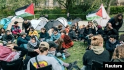 Students are seen gathered at an encampment with Palestinian flags at the University of Copenhagen's City Campus, in Copenhagen, Denmark, May 6, 2024. (Thomas Traasdahl/Ritzau Scanpix/via Reuters)