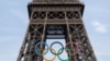 Olympic rings are pictured on the Eiffel tower ahead of Paris 2024, July 18, 2024.