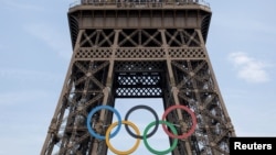 Olympic rings are pictured on the Eiffel tower ahead of Paris 2024, July 18, 2024.