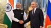 Russian President Vladimir Putin, right, and Indian Prime Minister Narendra Modi shake hands during a meeting at the Kremlin in Moscow, July 9, 2024.