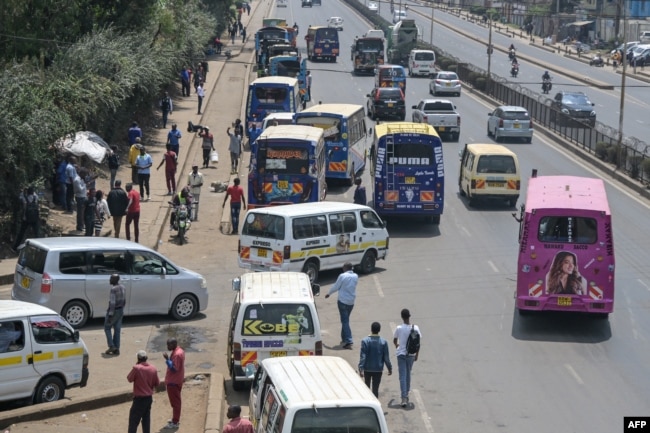 FILE - Kenyan public transport vehicles are seen picking up passengers in Nairobi, Sept. 12, 2023.