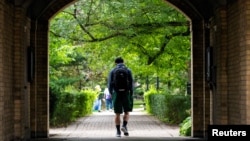 FILE - People walk on the grounds of the University of Toronto in Toronto, Ontario, Canada September 9, 2020. (REUTERS/Carlos Osorio/File Photo)