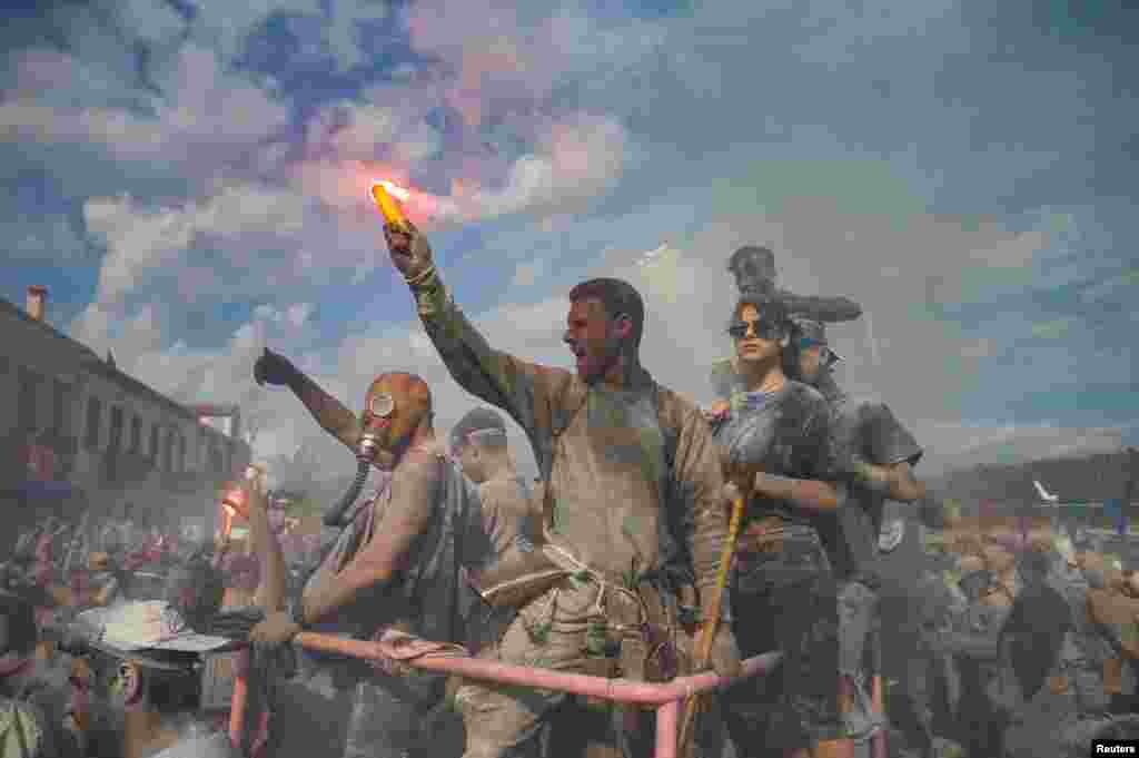 Revelers participate in a colorful &quot;flour war&quot;, celebrating the &quot;Ash Monday&quot; or &quot;Clean Monday&quot;, a traditional festivity marking the start of the 40-day Lent period until the Orthodox Easter, in the town of Galaxidi, Greece.